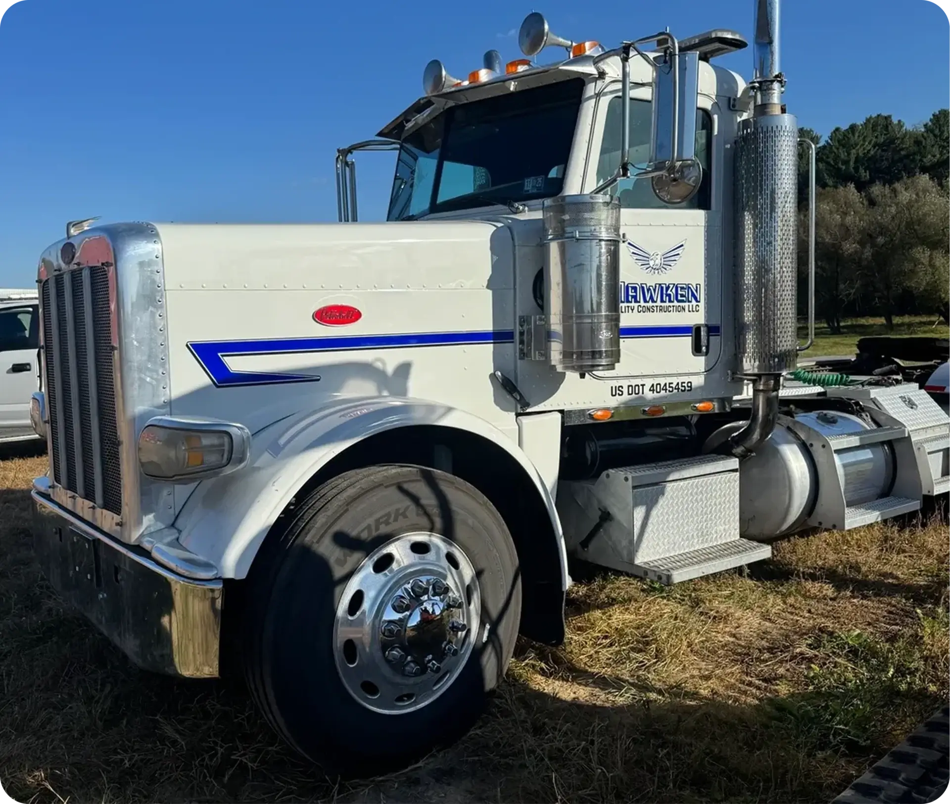 Large white truck in sunlight